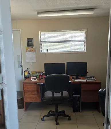 a view of a gallery with wooden door