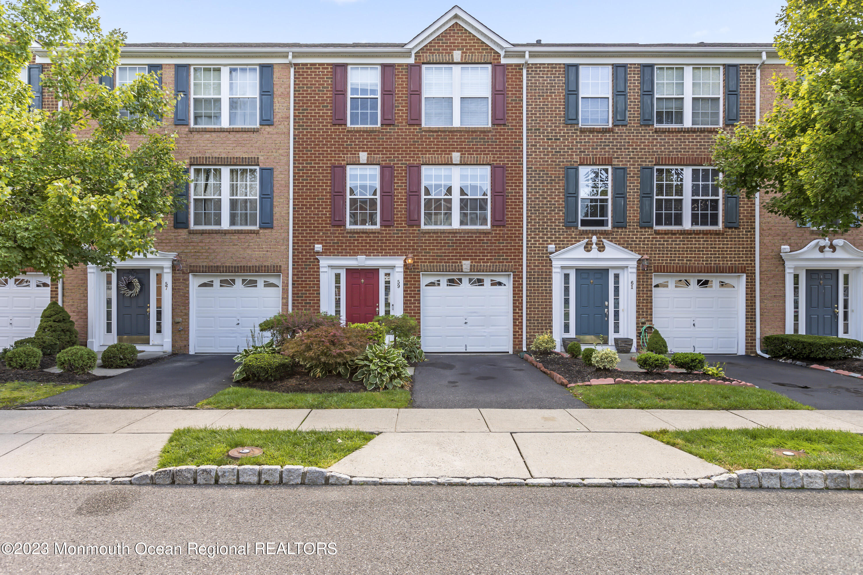59 Saxton Road Farmingdale, NJ 07727 - Photo 1 of 30 a front view of residential houses with yard