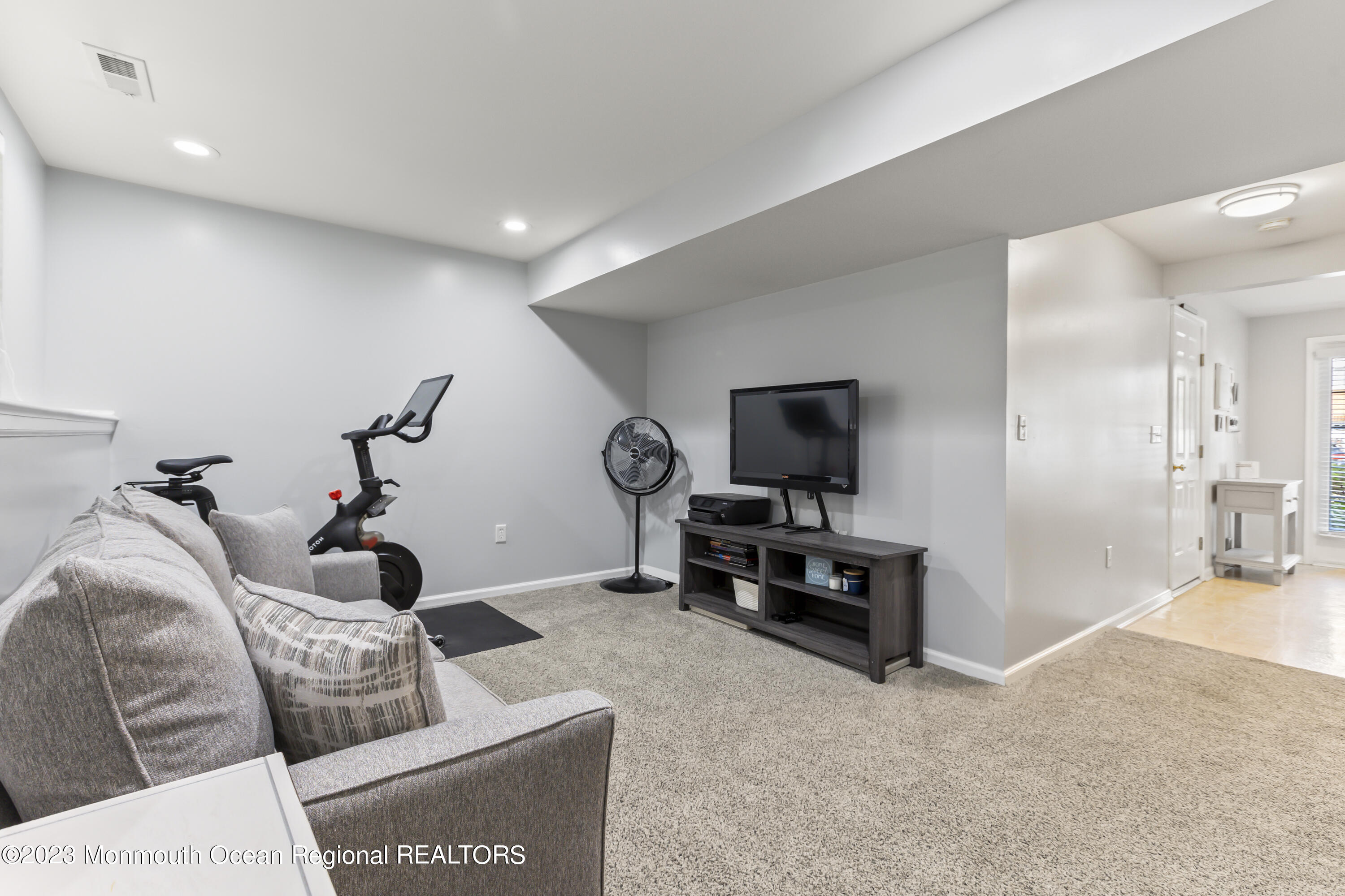 59 Saxton Road Farmingdale, NJ 07727 - Photo 5 of 30 a living room with furniture and a flat screen tv