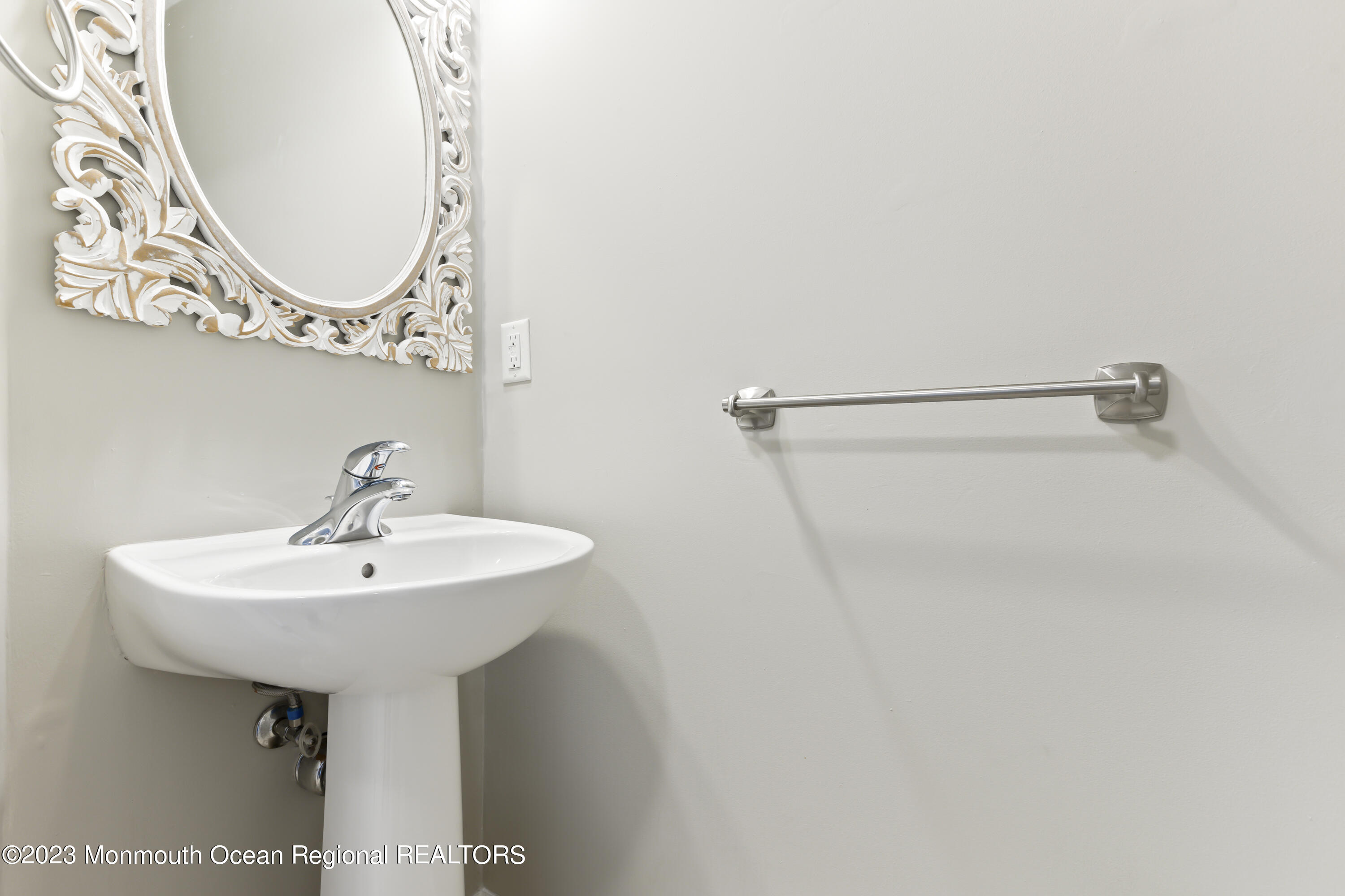 59 Saxton Road Farmingdale, NJ 07727 - Photo 7 of 30 a bathroom with a sink a mirror and vanity
