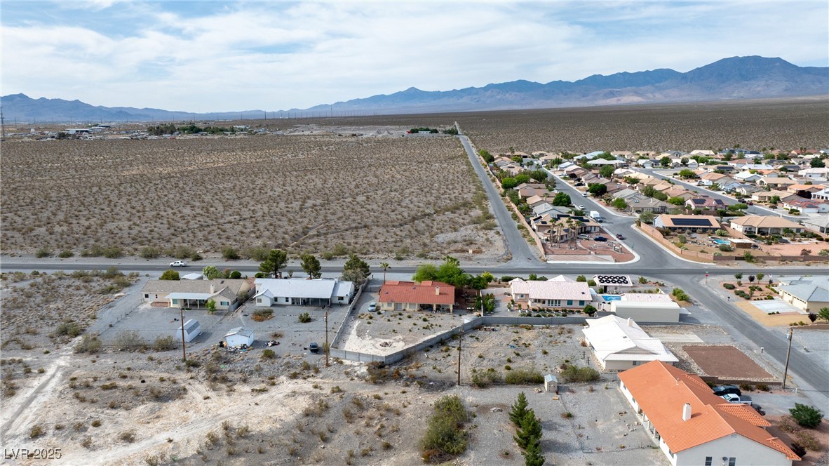 3481 Winery Road Pahrump, NV 89048 - Photo 34 of 34 Aerial view of residential area featuring mountains and a desert landscape