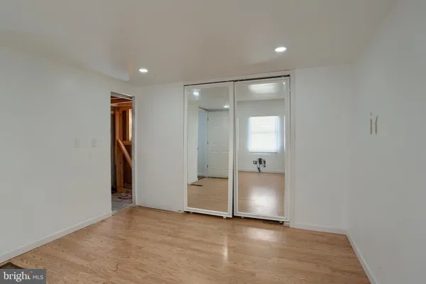 a view of a backyard with a large tree