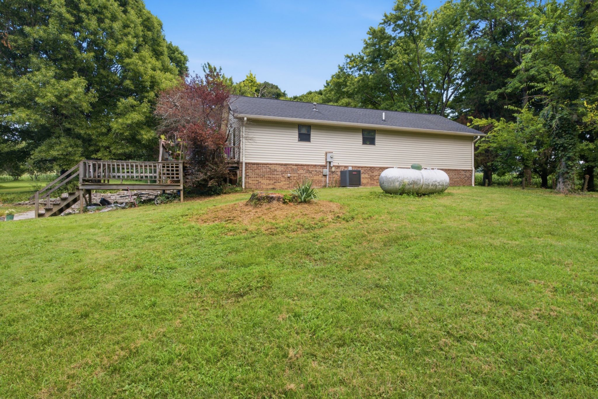 145 Crenshaw Road Bethpage, TN 37022 - Photo 4 of 34 a view of a house with a yard and sitting area