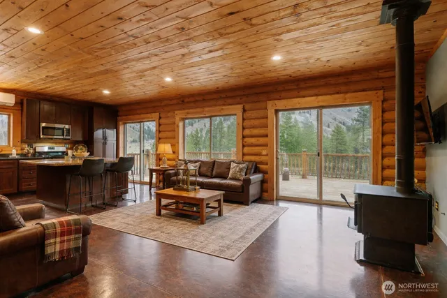 a view of a livingroom with furniture and a flat screen tv