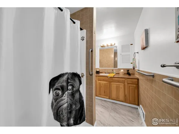 a kitchen with a refrigerator and a stove