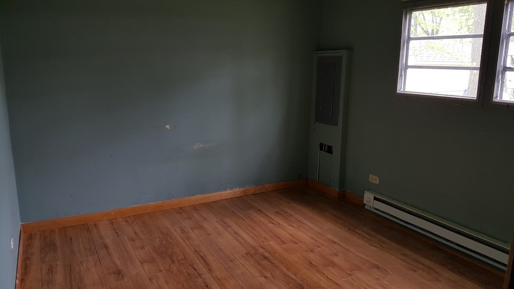 78 Better Way Springfield, MA 01119 - Photo 9 of 10 an empty room with wooden floor and windows