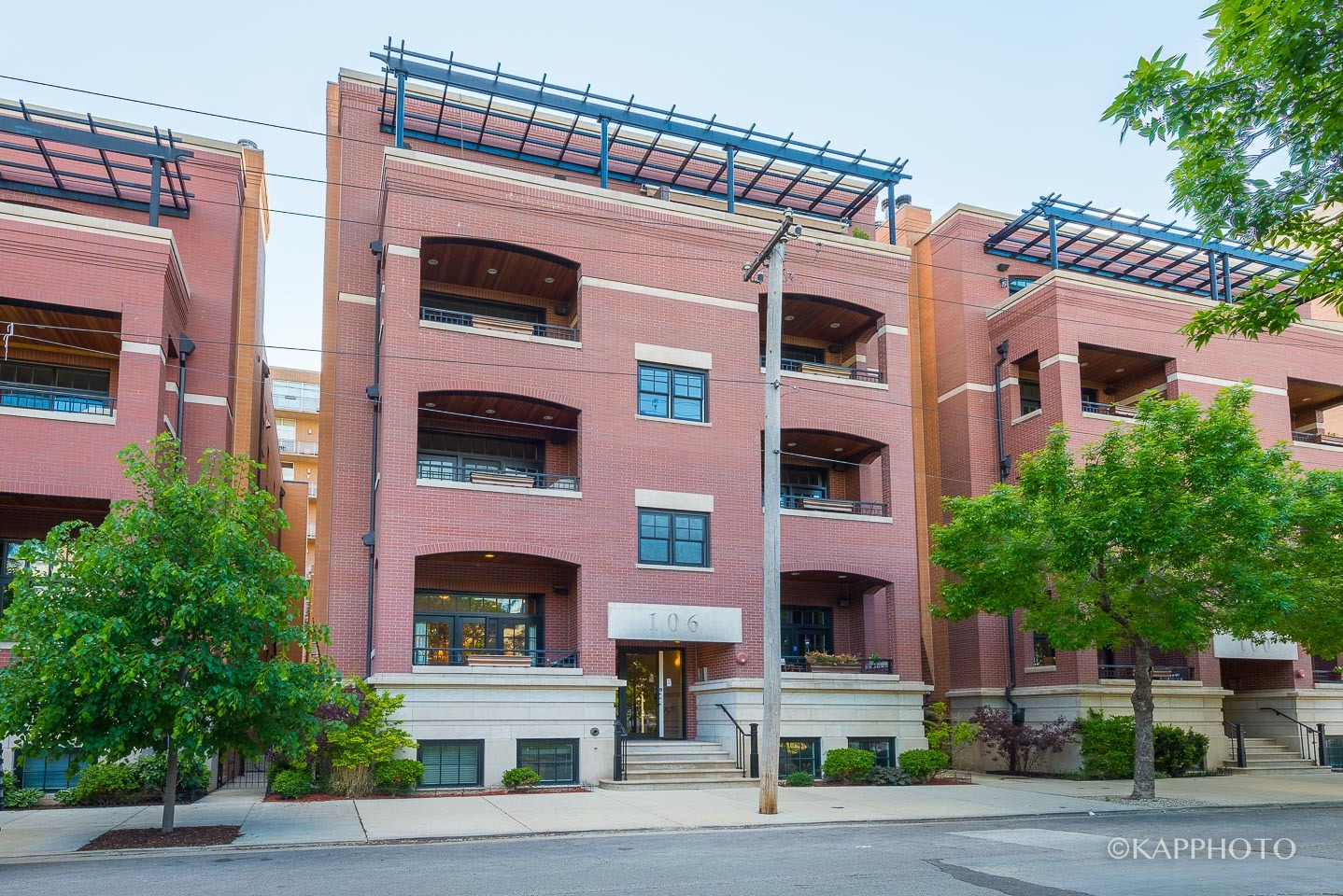 106 South Sangamon Street, Unit 2S Chicago, IL 60607 - Photo 1 of 29 a front view of a multi story building with a yard