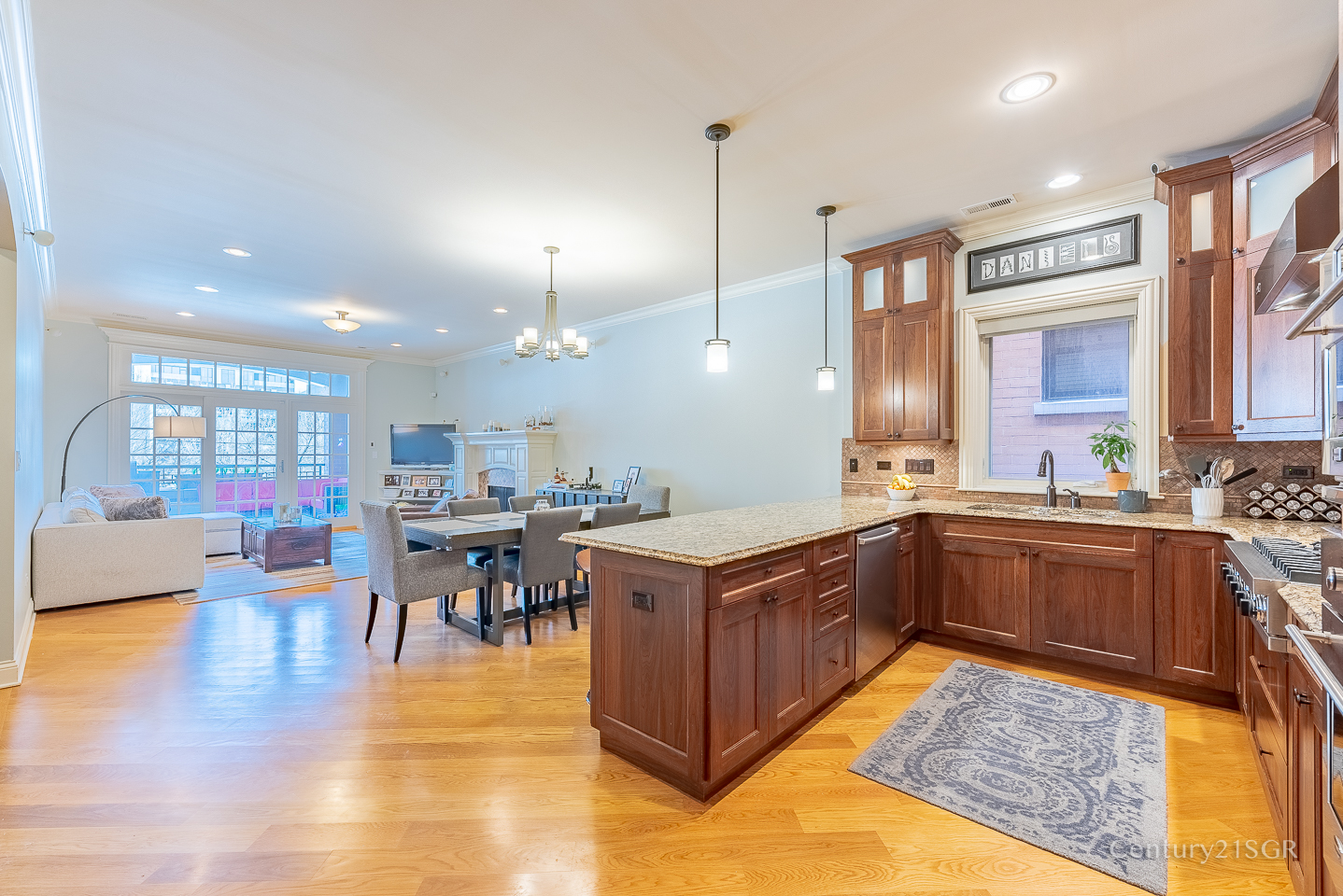 106 South Sangamon Street, Unit 2S Chicago, IL 60607 - Photo 11 of 29 a large kitchen with kitchen island a sink table and chairs