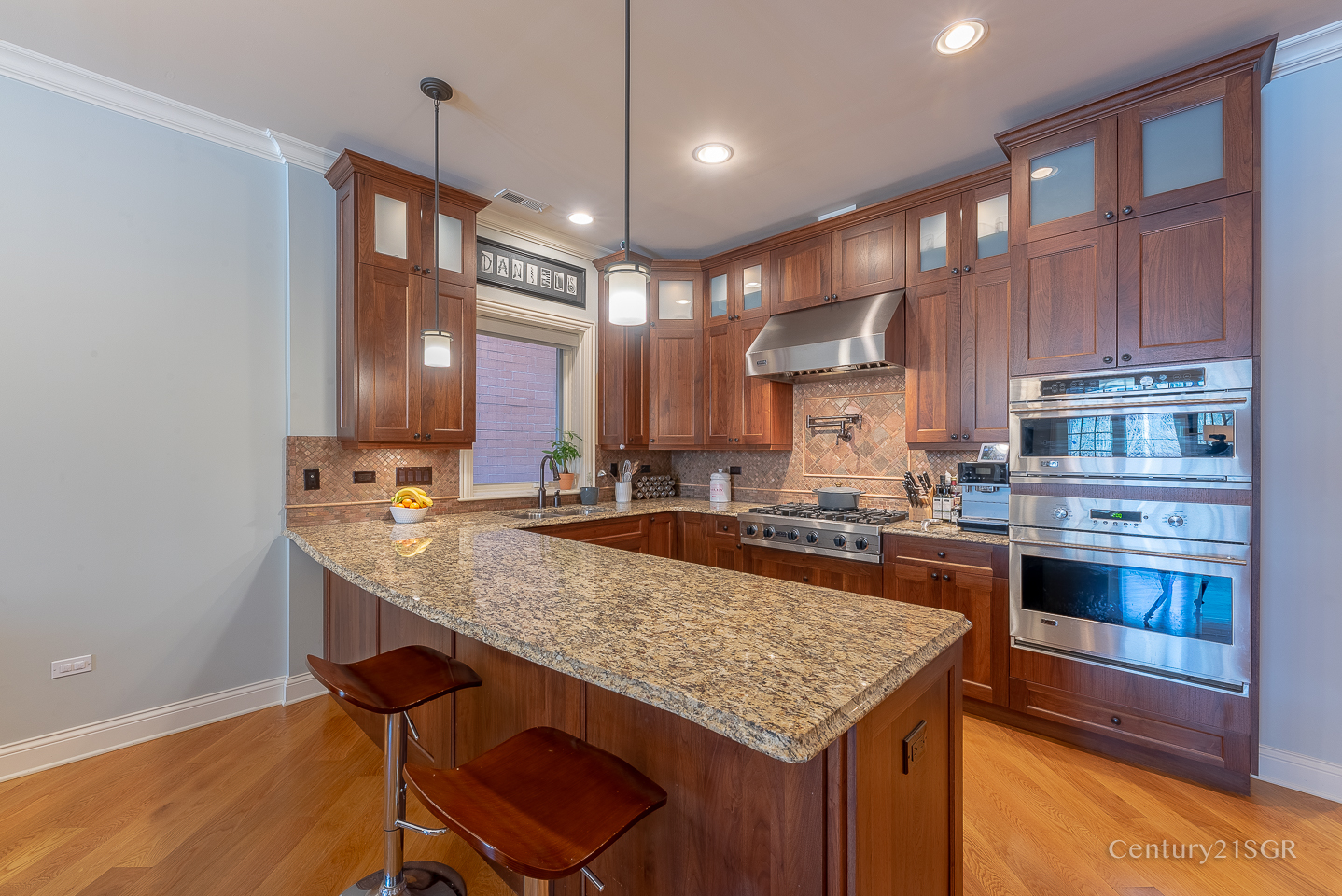 106 South Sangamon Street, Unit 2S Chicago, IL 60607 - Photo 12 of 29 a kitchen with granite countertop kitchen island stainless steel appliances a sink stove and oven