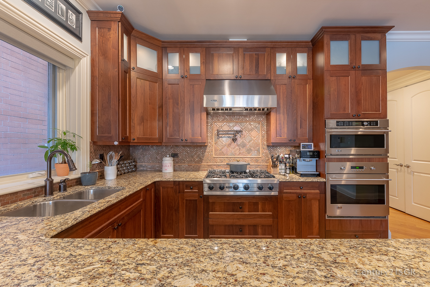 106 South Sangamon Street, Unit 2S Chicago, IL 60607 - Photo 14 of 29 a kitchen with stainless steel appliances granite countertop a sink stove and refrigerator