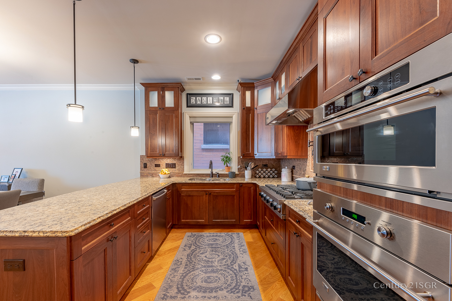 106 South Sangamon Street, Unit 2S Chicago, IL 60607 - Photo 15 of 29 a kitchen with stainless steel appliances granite countertop a sink a stove and a wooden floors