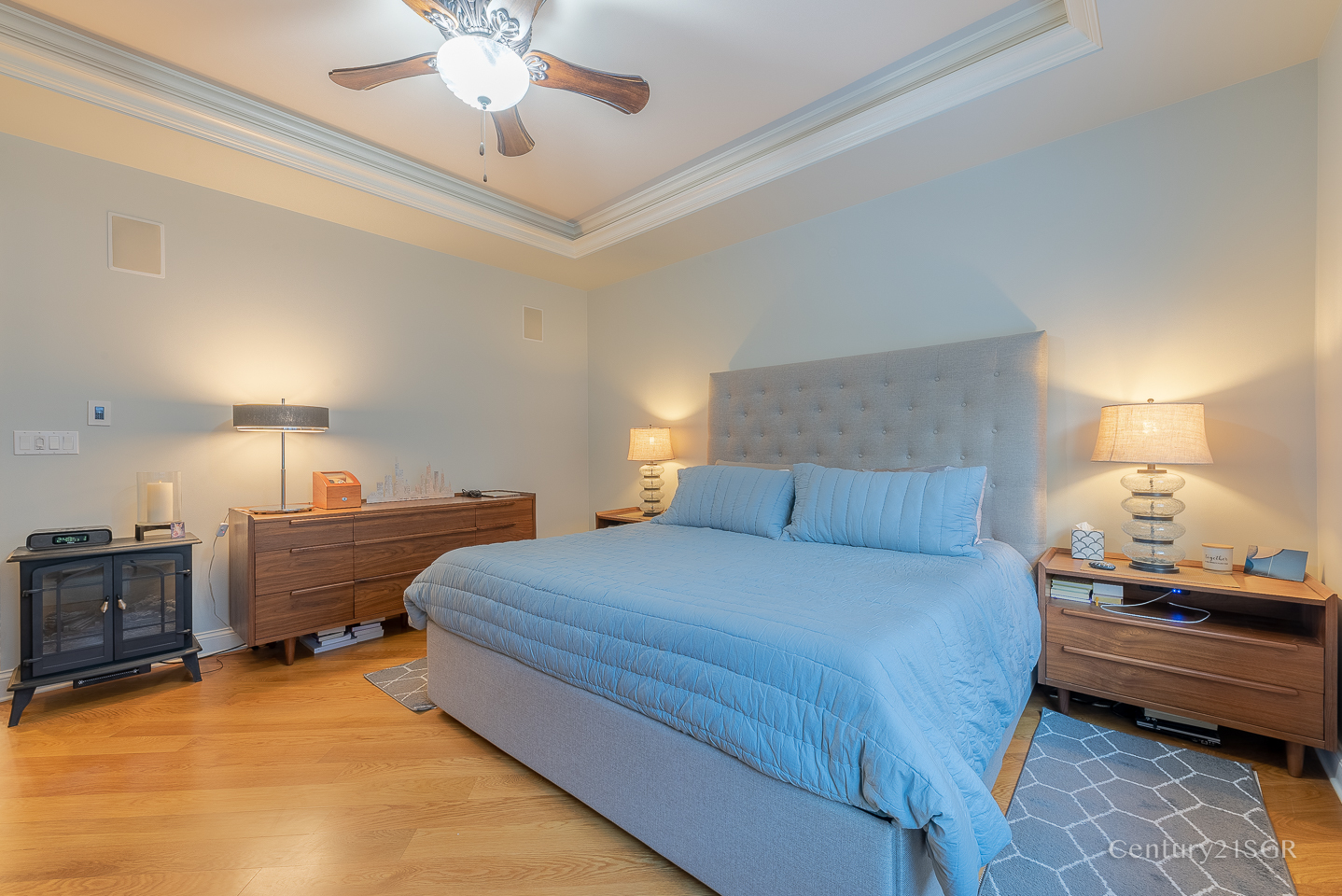 106 South Sangamon Street, Unit 2S Chicago, IL 60607 - Photo 17 of 29 a bedroom with a bed and a chandelier