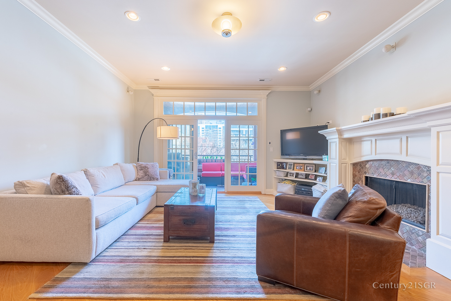 106 South Sangamon Street, Unit 2S Chicago, IL 60607 - Photo 3 of 29 a living room with furniture fireplace and a flat screen tv