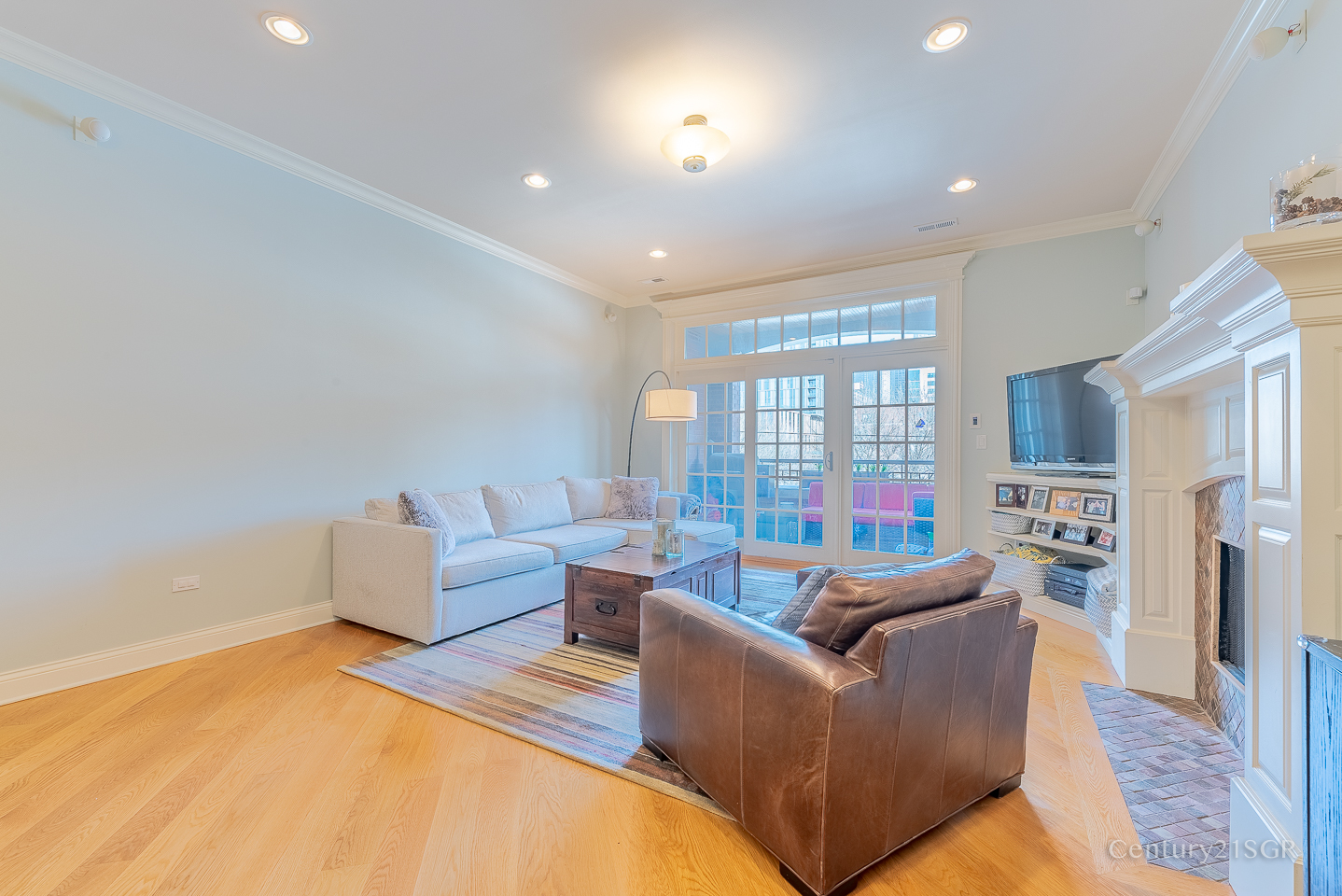 106 South Sangamon Street, Unit 2S Chicago, IL 60607 - Photo 5 of 29 a living room with furniture and a flat screen tv