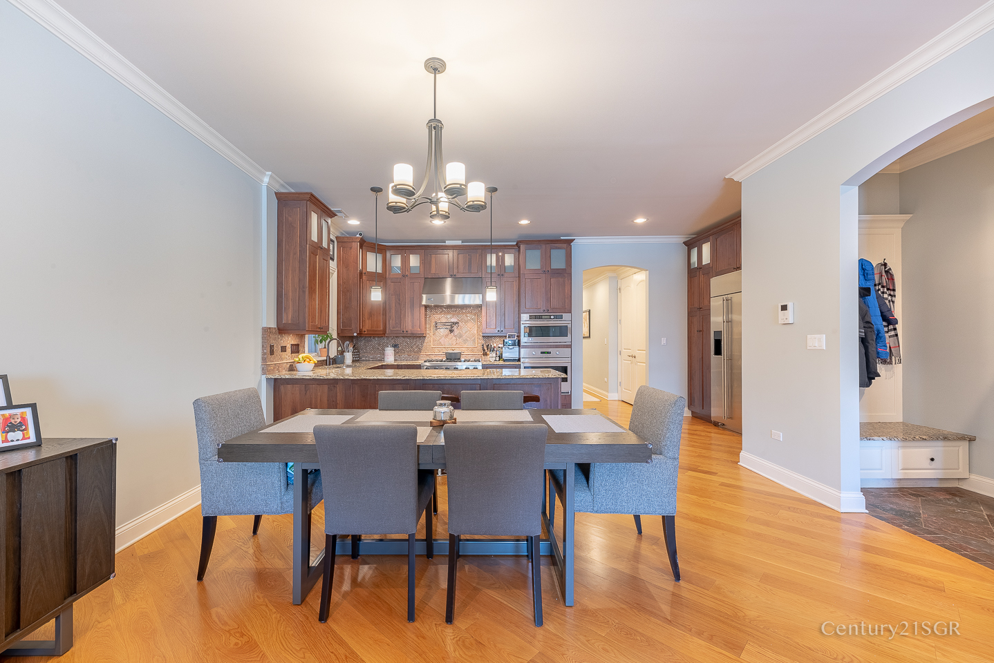106 South Sangamon Street, Unit 2S Chicago, IL 60607 - Photo 9 of 29 a view of a dining room with furniture a chandelier and wooden floor