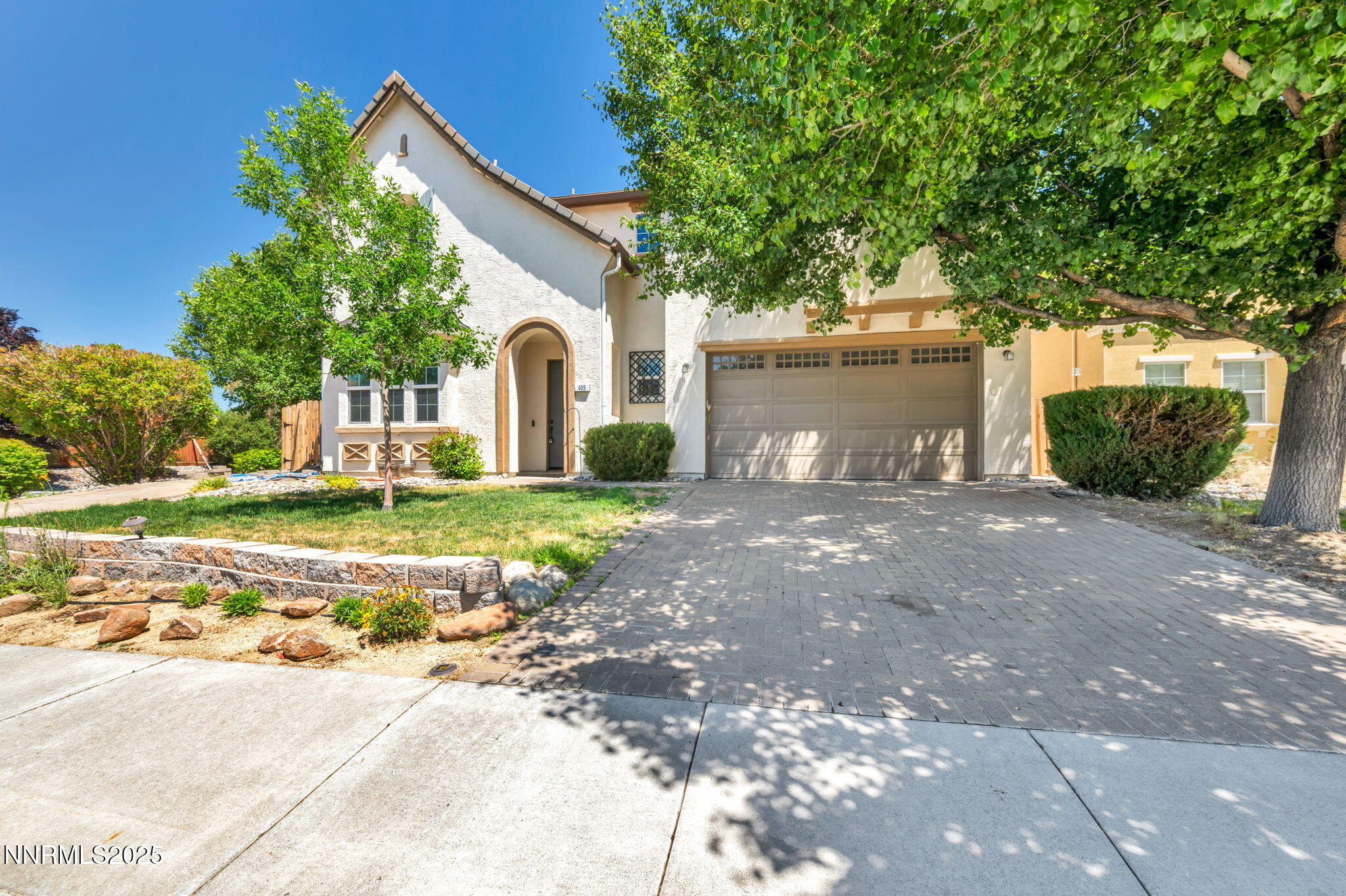 405 Sondrio Court Reno, NV 89521 - Photo 1 of 58 a front view of a house with a yard and garage