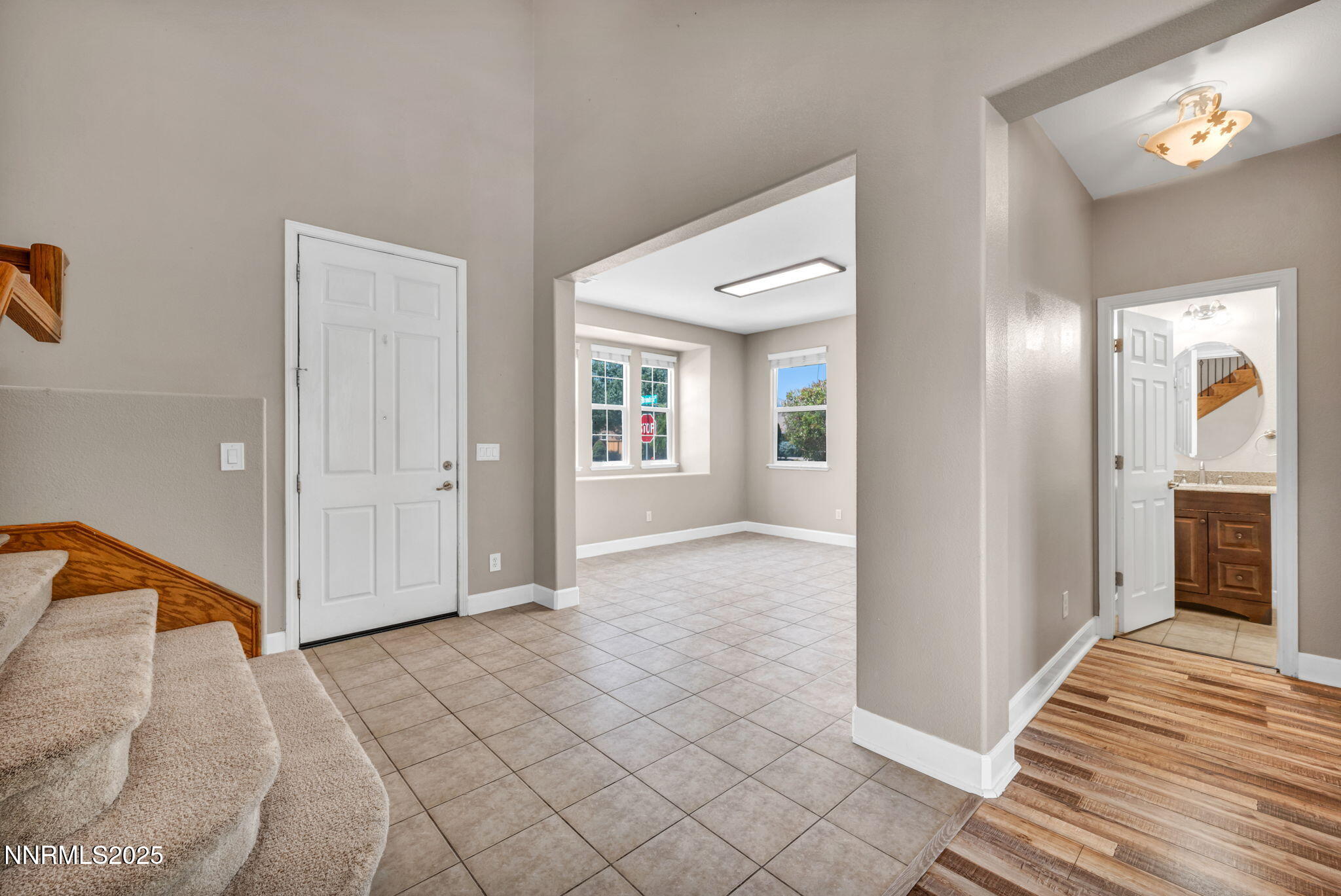 405 Sondrio Court Reno, NV 89521 - Photo 15 of 58 a view of a livingroom with wooden floor and a bathroom