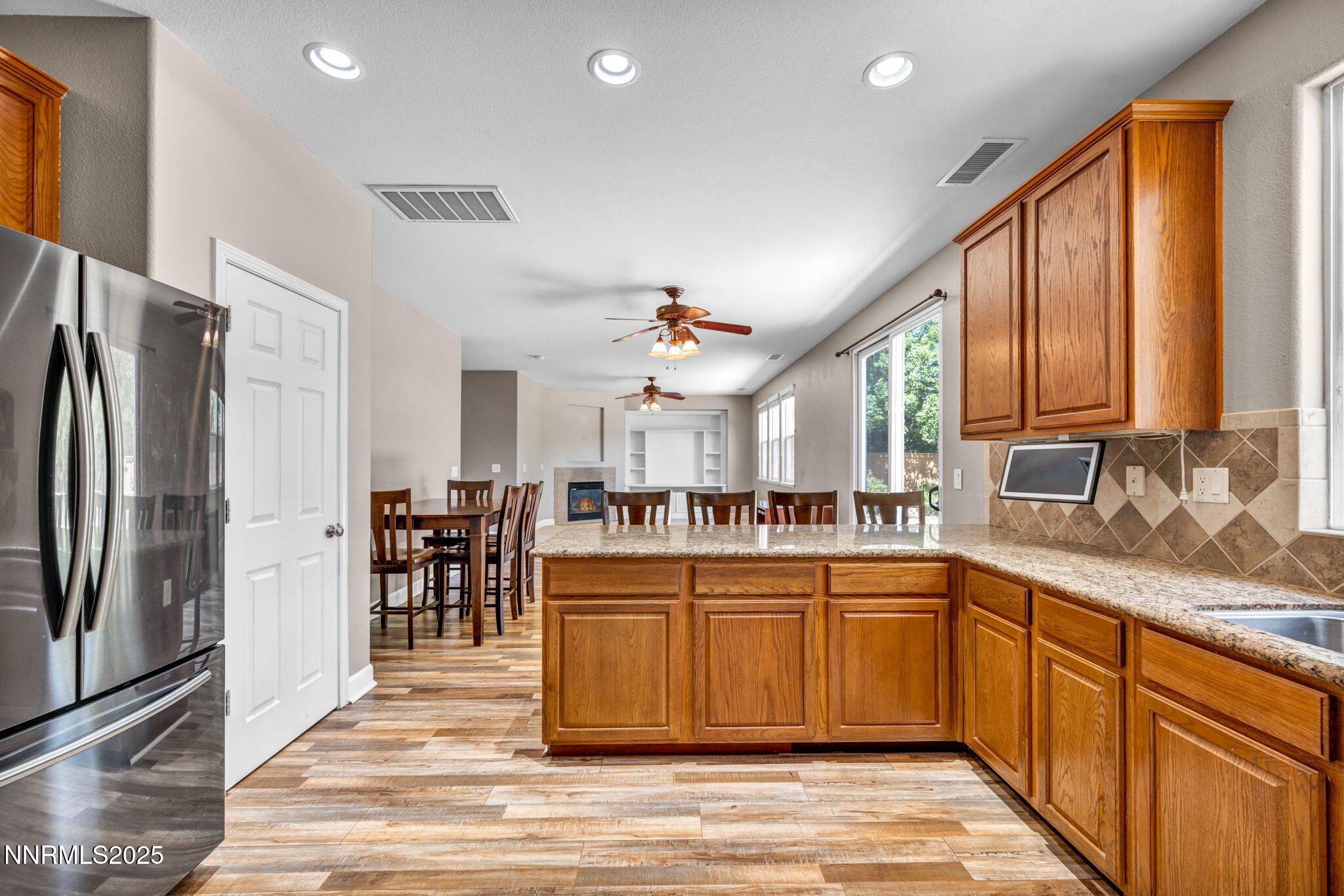 405 Sondrio Court Reno, NV 89521 - Photo 23 of 58 a kitchen with lots of counter top space and stainless steel appliances