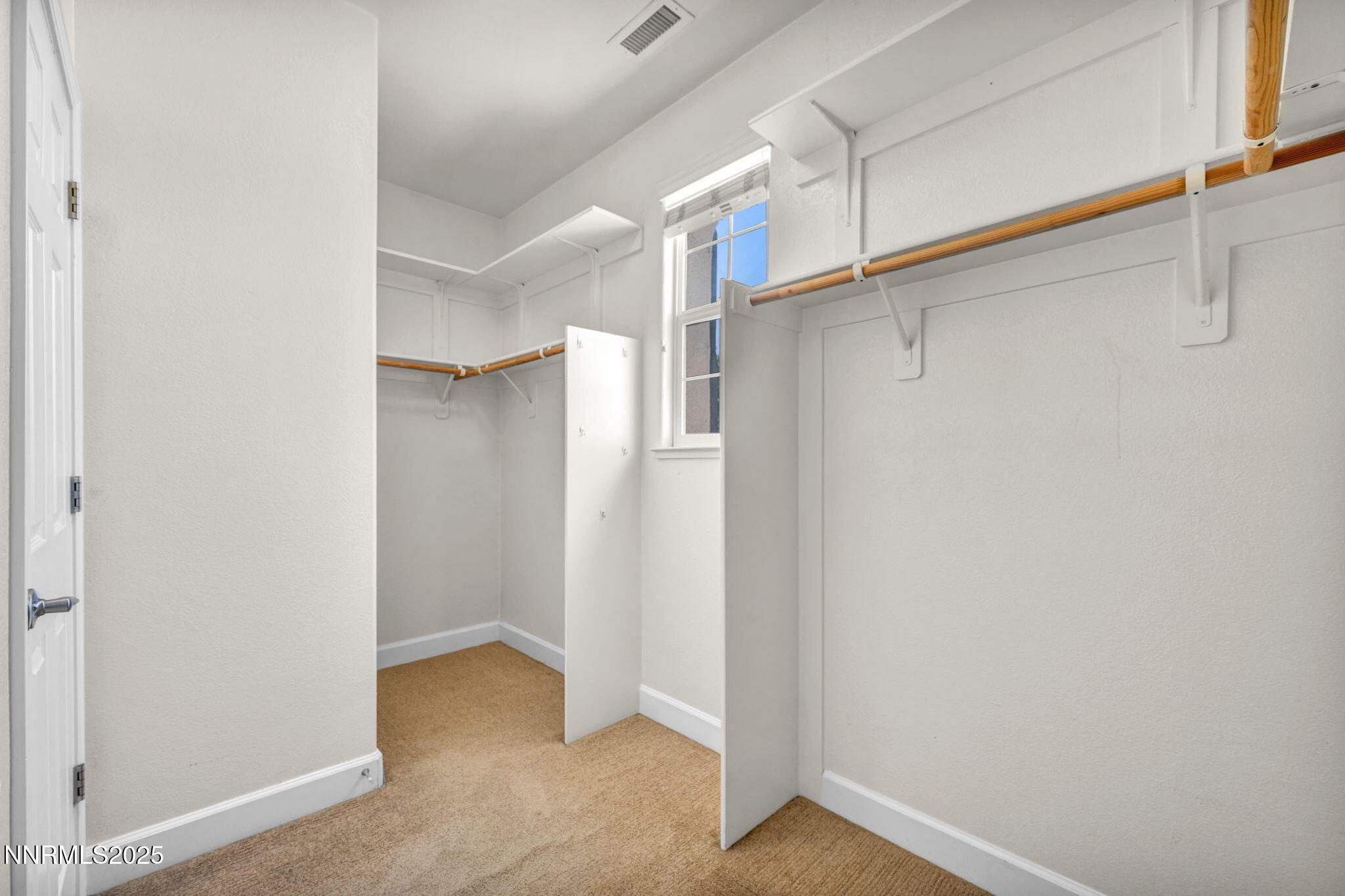 405 Sondrio Court Reno, NV 89521 - Photo 25 of 58 a view of walk in closet with empty racks