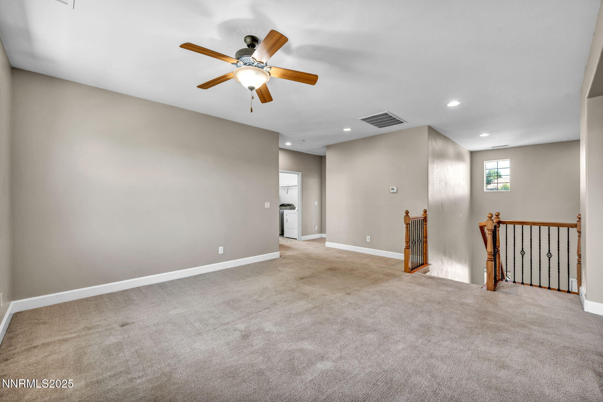 405 Sondrio Court Reno, NV 89521 - Photo 30 of 58 an empty room with windows and fan