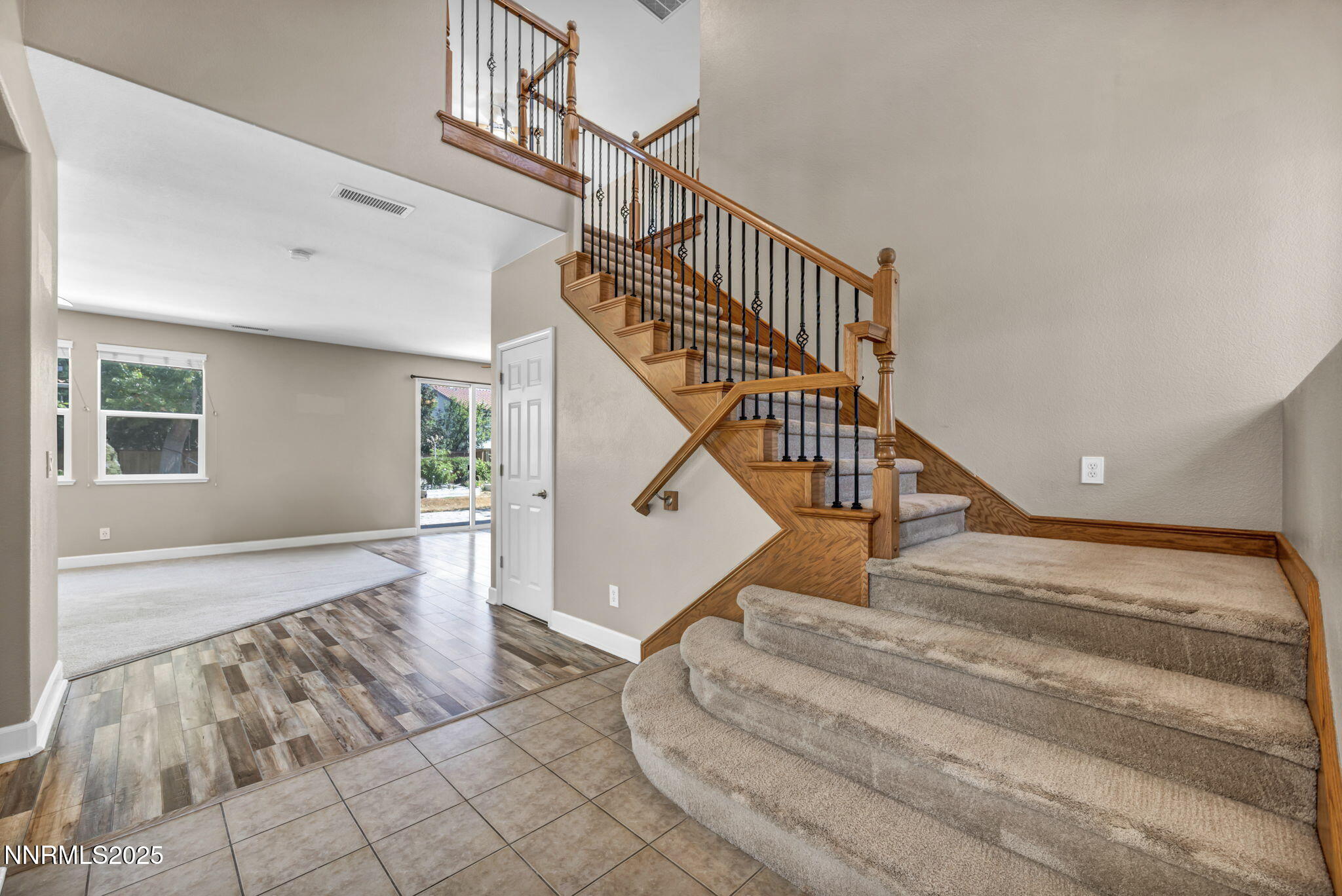 405 Sondrio Court Reno, NV 89521 - Photo 3 of 58 a view of entryway and hall with wooden floor