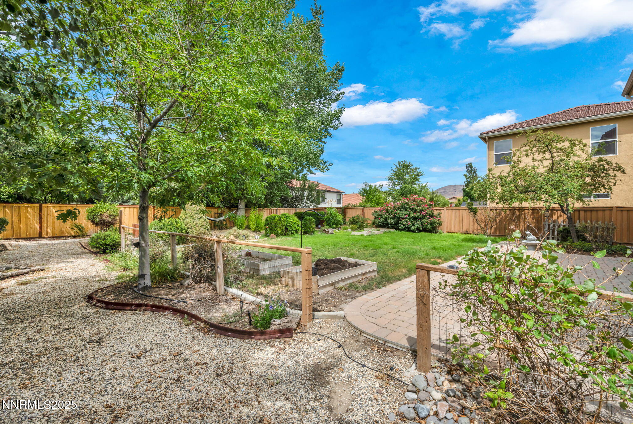405 Sondrio Court Reno, NV 89521 - Photo 43 of 58 a view of a table and chairs in the garden