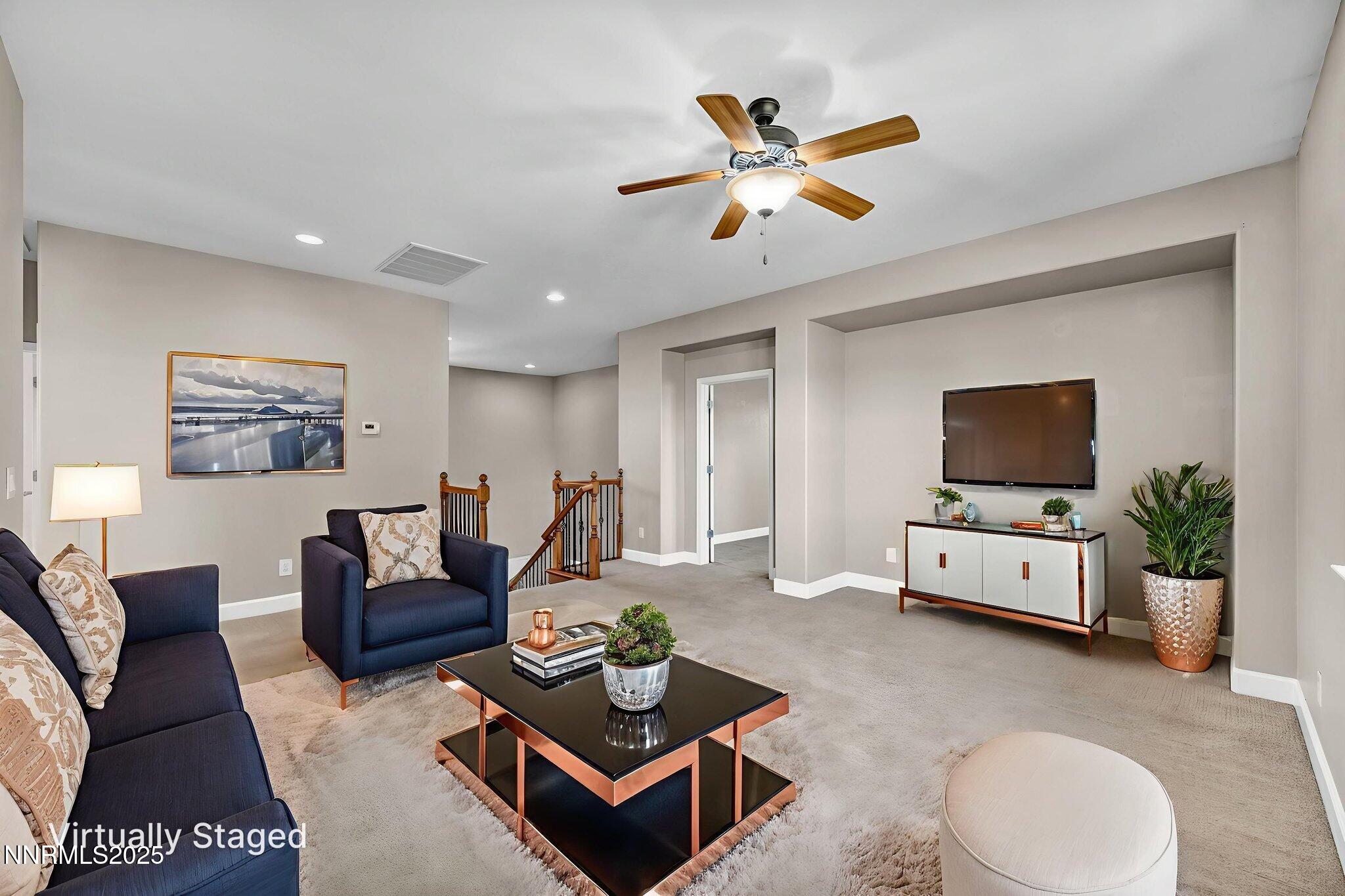 405 Sondrio Court Reno, NV 89521 - Photo 7 of 58 a living room with furniture and a flat screen tv