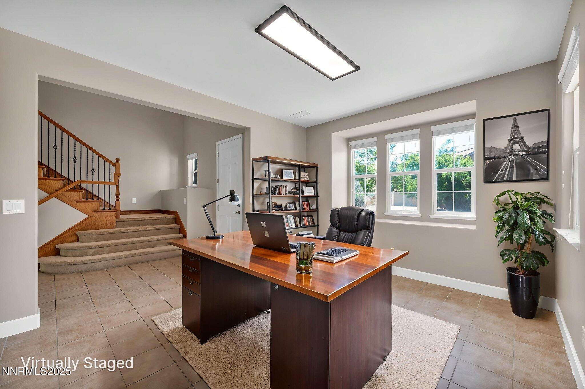 405 Sondrio Court Reno, NV 89521 - Photo 9 of 58 a room with furniture and a potted plant
