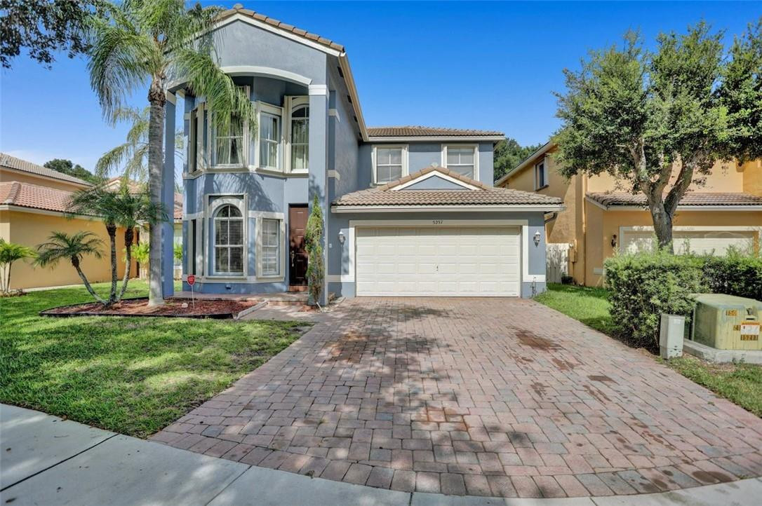 5257 Sancerre Circle Lake Worth, FL 33463 - Photo 1 of 46 front view of a house with a yard