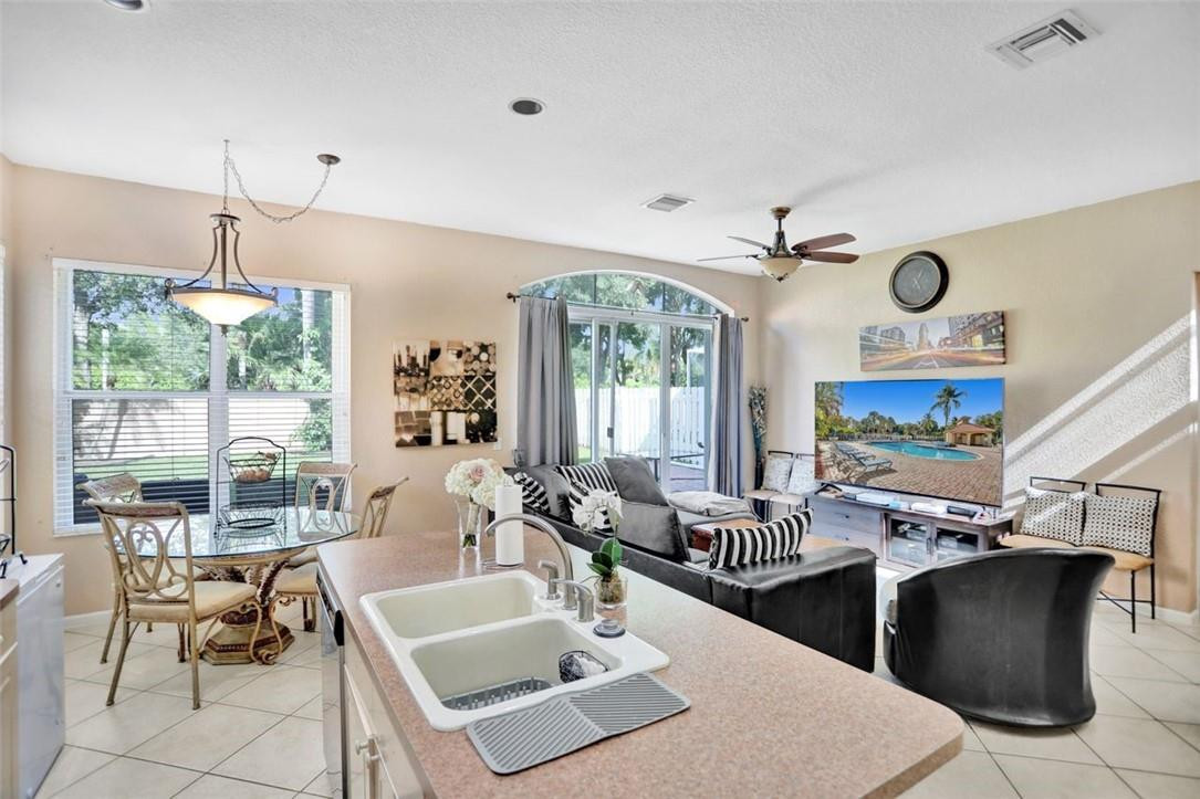 5257 Sancerre Circle Lake Worth, FL 33463 - Photo 19 of 46 a room with lots of table and chairs