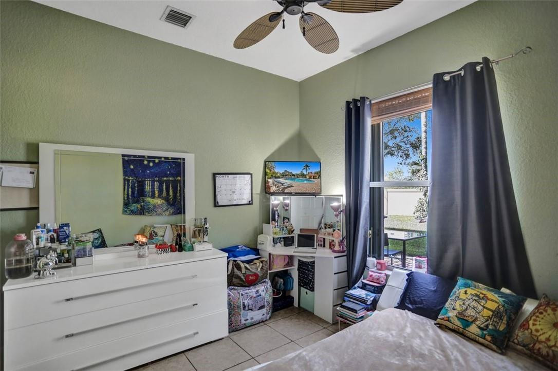 5257 Sancerre Circle Lake Worth, FL 33463 - Photo 23 of 46 a living room with furniture and a large window
