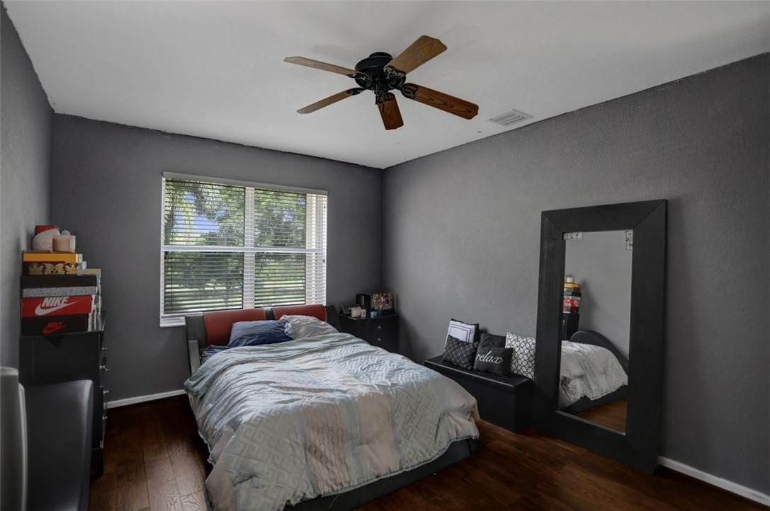 5257 Sancerre Circle Lake Worth, FL 33463 - Photo 26 of 46 a bedroom with a bed and a window