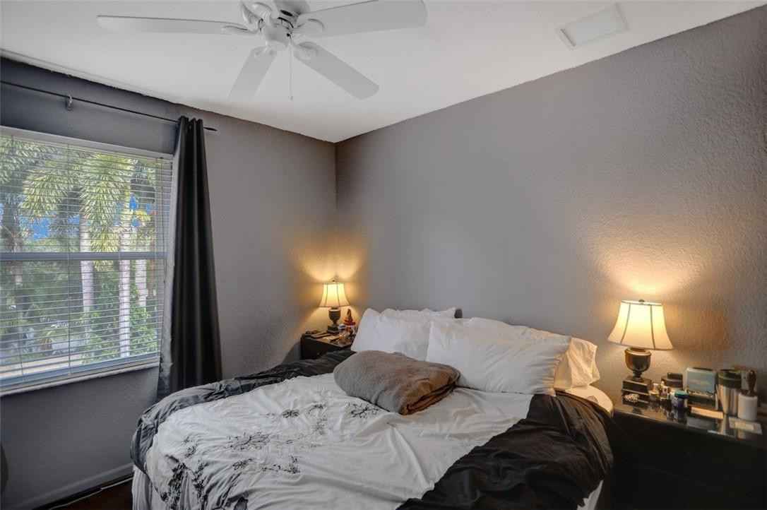 5257 Sancerre Circle Lake Worth, FL 33463 - Photo 34 of 46 a bedroom with a bed and a window