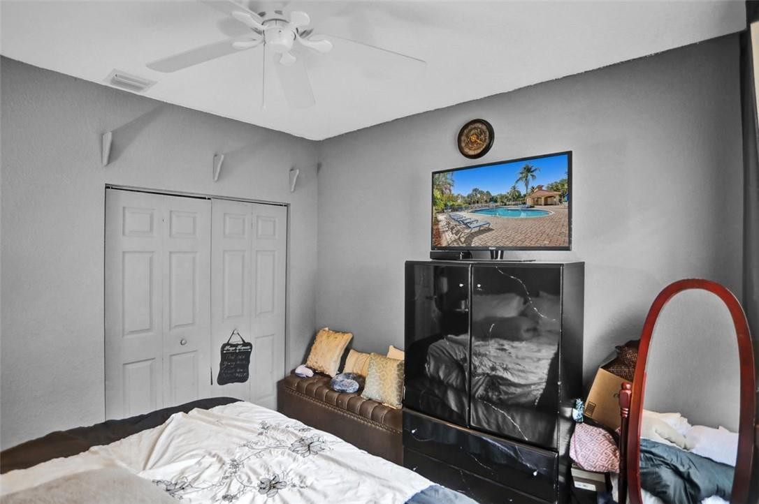 5257 Sancerre Circle Lake Worth, FL 33463 - Photo 35 of 46 a view of a bedroom with workspace and bedroom