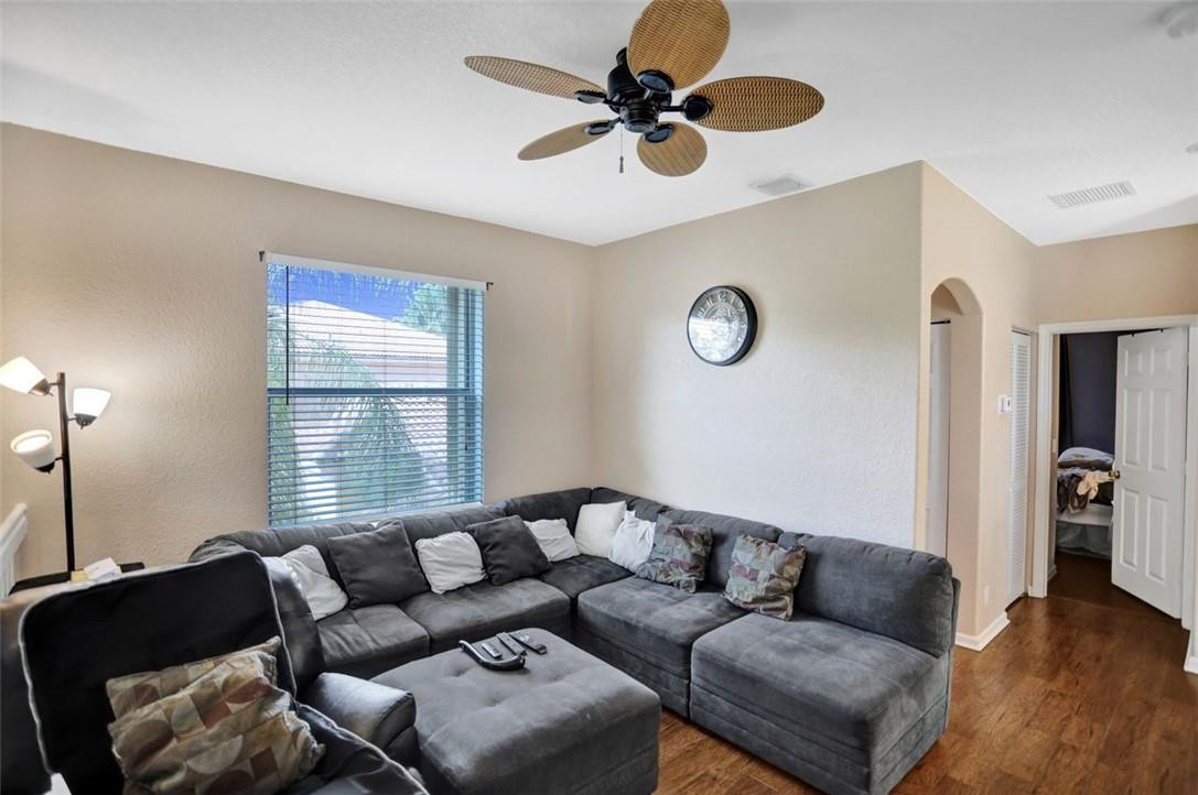 5257 Sancerre Circle Lake Worth, FL 33463 - Photo 38 of 46 a living room with furniture and a window