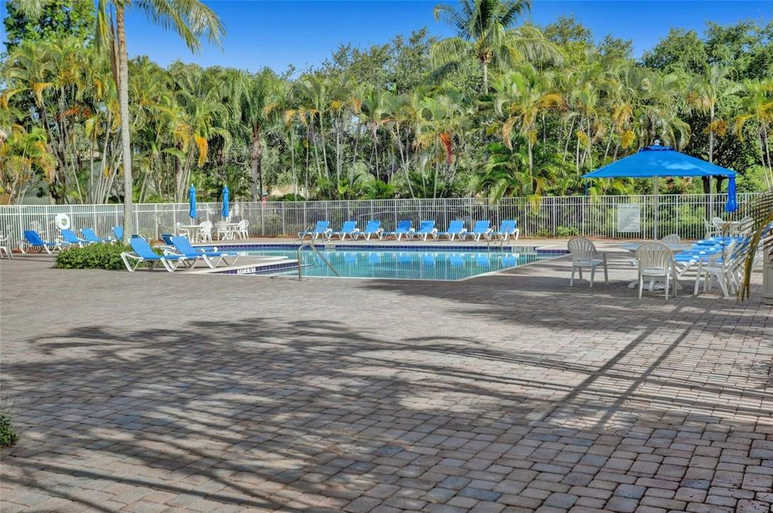 5257 Sancerre Circle Lake Worth, FL 33463 - Photo 42 of 46 a view of street with bench and trees