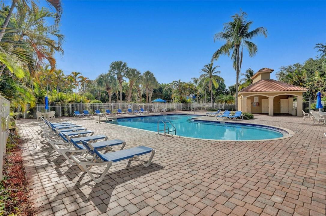 5257 Sancerre Circle Lake Worth, FL 33463 - Photo 44 of 46 a view of a swimming pool with a patio and a yard