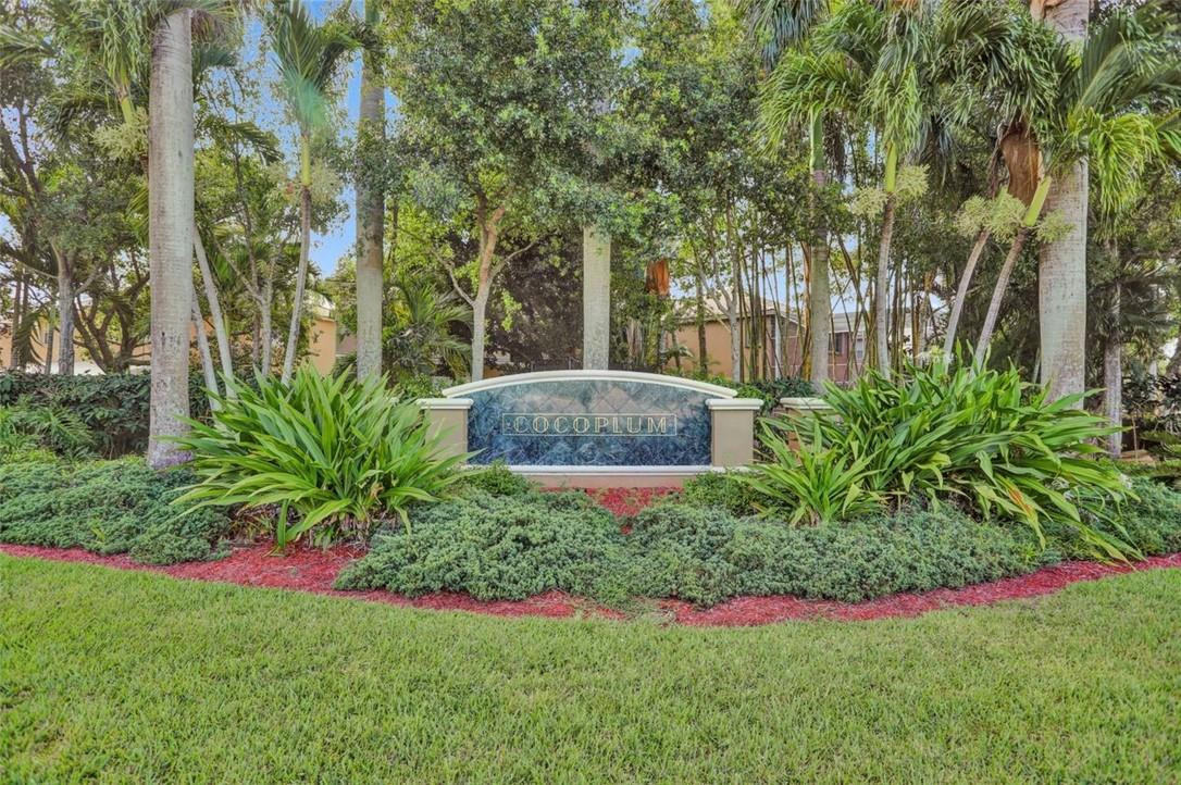 5257 Sancerre Circle Lake Worth, FL 33463 - Photo 45 of 46 a view of a garden with plants and large trees