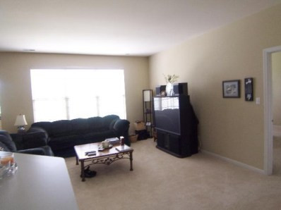 10058 Prairie St-john In 46373 St. John, IN 46373 - Photo 6 of 10 a living room with furniture and a couch