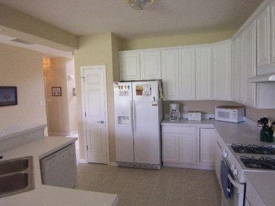 10058 Prairie St-john In 46373 St. John, IN 46373 - Photo 7 of 10 a kitchen with stainless steel appliances a refrigerator and a stove top oven