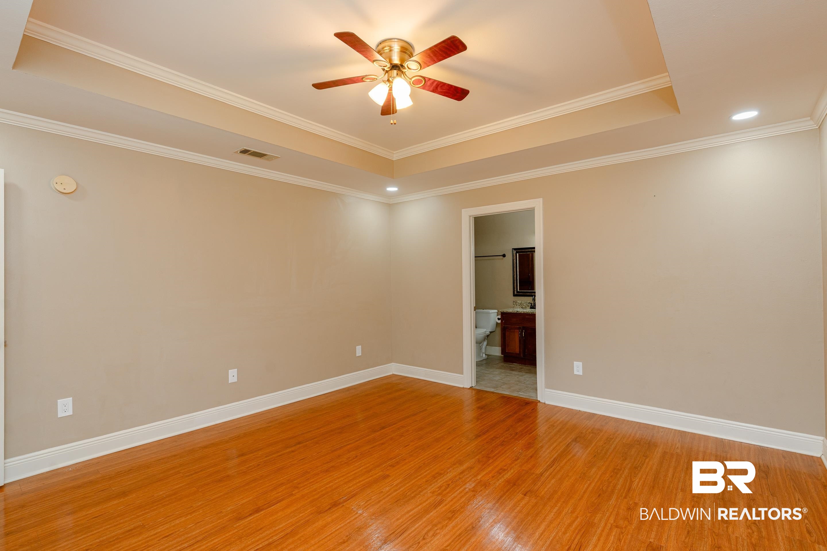 23 Old Mill Court Mobile, AL 36608 - Photo 20 of 37 Spare room with light wood-type flooring, ceiling fan, a raised ceiling, and ornamental molding