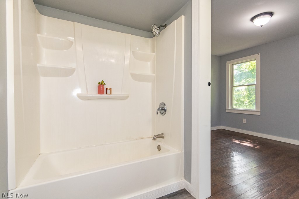 16506 Leroy Thompson Road Thompson, OH 44086 - Photo 22 of 41 Bathroom with wood-type flooring and shower / washtub combination