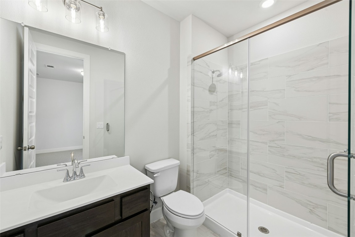 1528 Rodeo Ridge Drive Georgetown, TX 78628 - Photo 11 of 28 Full bath featuring a stall shower and vanity