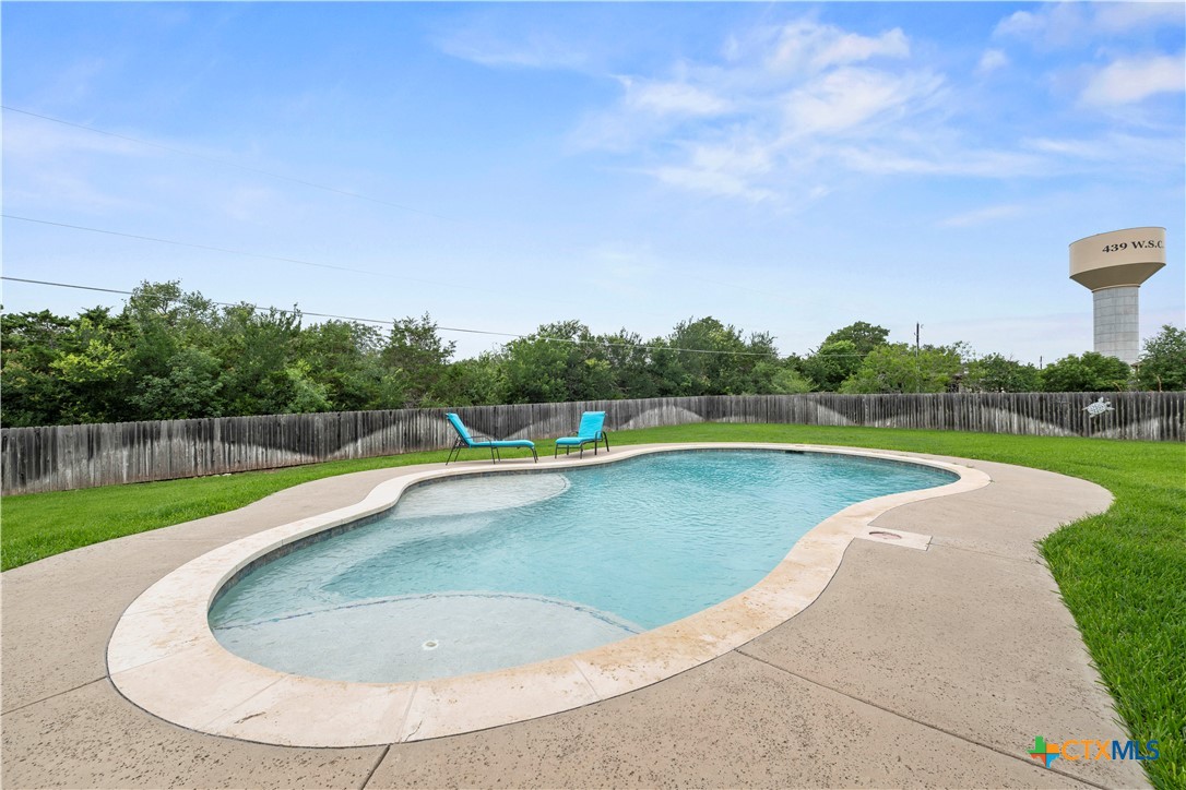 2649 Bowles Ranch Road Belton, TX 76513 - Photo 33 of 36 a view of a swimming pool with a yard