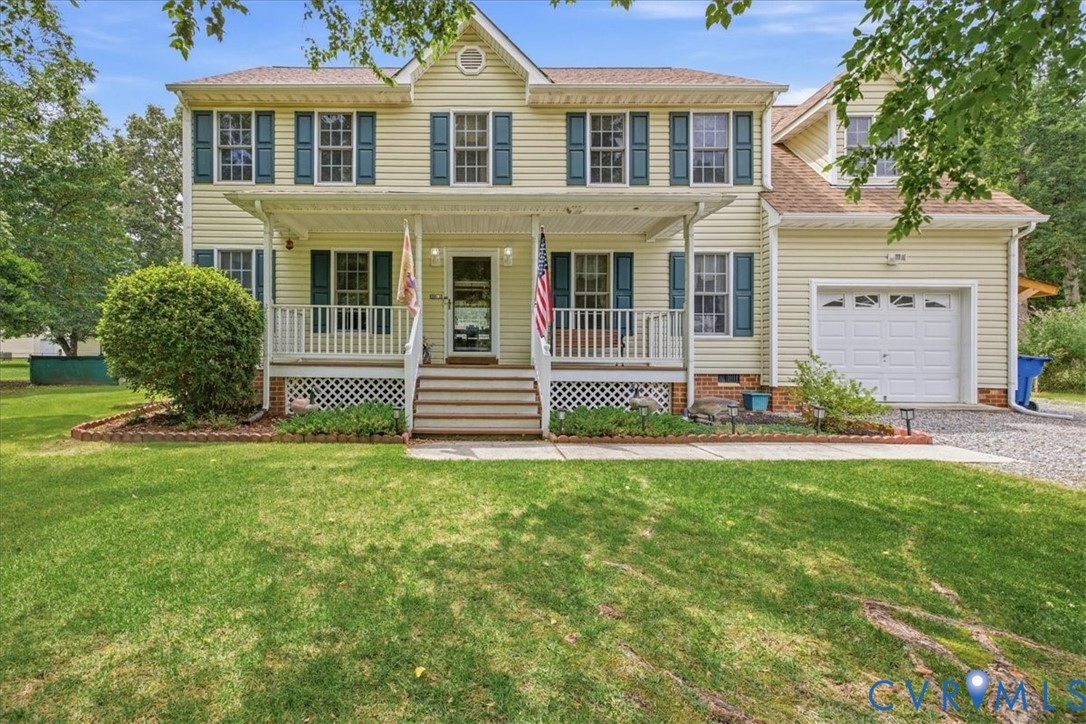 Classic two-story Colonial with welcoming front po