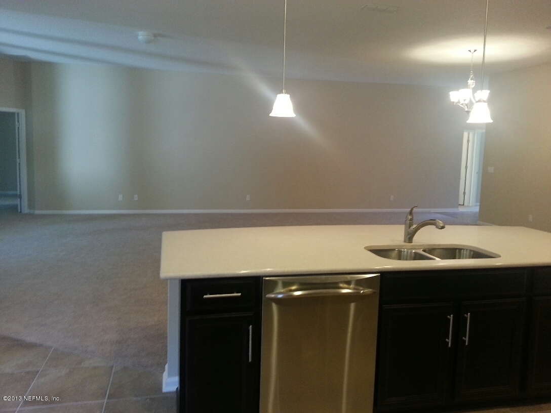 97236 Bluff View Circle Yulee, FL 32097 - Photo 8 of 60 a bathroom with a sink and a mirror