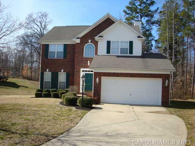 3741 Marbury Road Charlotte, NC 28269 - Photo 1 of 16 a front view of a house with a yard and garage