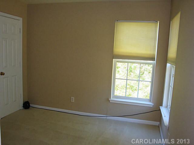 3741 Marbury Road Charlotte, NC 28269 - Photo 14 of 16 a view of an empty room with a window