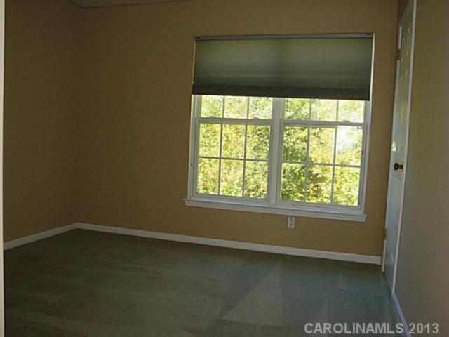 3741 Marbury Road Charlotte, NC 28269 - Photo 15 of 16 an empty room with a window
