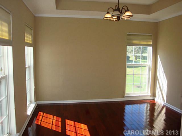 3741 Marbury Road Charlotte, NC 28269 - Photo 4 of 16 a view of an empty room with a window